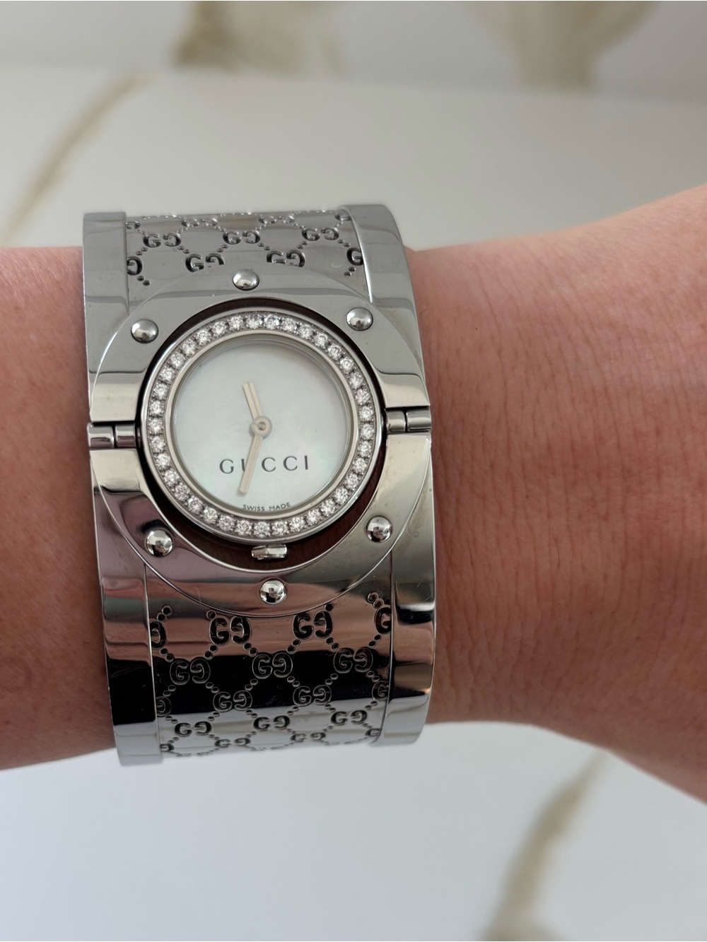 Gucci Silver-Tone GG Logo Bangle Watch with Mother-of-Pearl Dial & diamond bezel